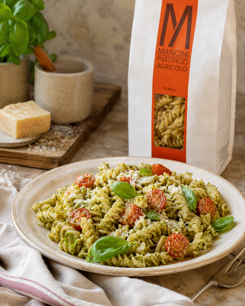 asta Mancini Fusilli with basil pesto, tomatoes and Parmigiano