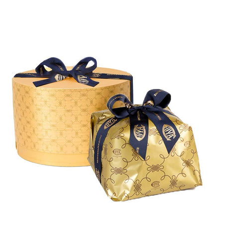 Gold gift box with navy ribbon on a white background