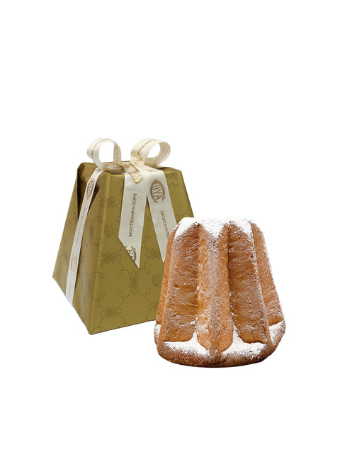 A packaged Luxury Italian Pandoro cake next to an unwrapped Pandoro cake dusted with powdered sugar, presented against a white background.