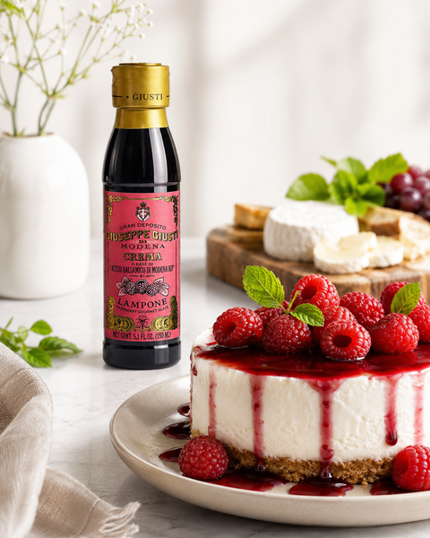 Giusti raspberry balsamic glaze served with cheesecake fresh raspberries and cheese